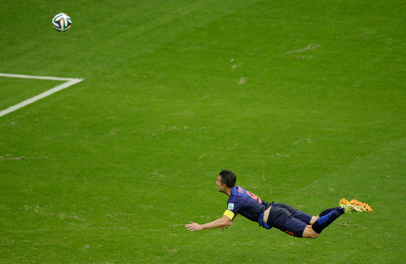 Illustration for article titled The Best Photos Of Robin Van Persie's Amazing Flying Header Goal